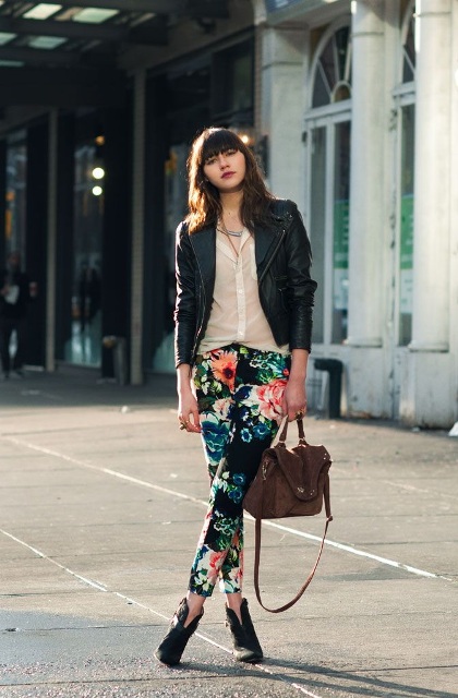 With black leather jacket, button down shirt, leather bag and ankle boots