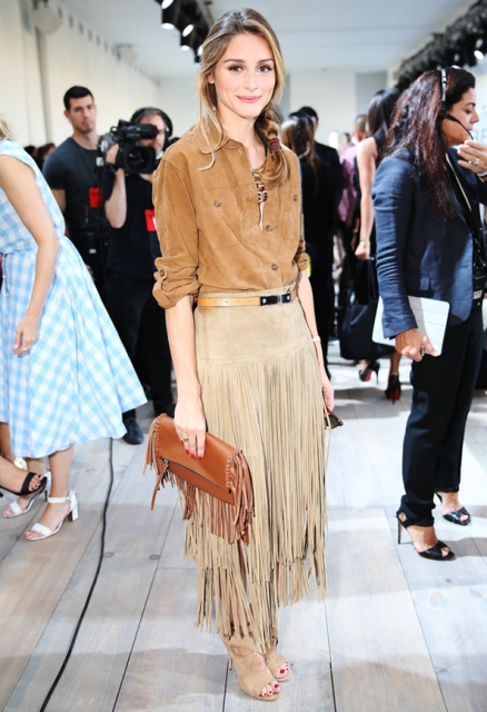 With brown button down shirt, brown fringe clutch and beige shoes