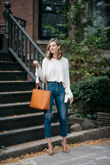 With cropped jeans, brown tote bag and beige pumps
