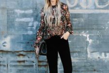 With floral blouse, black bag and black boots