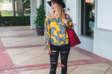 With hat, red tote, distressed jeans and high heels