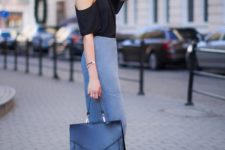 With off the shoulder shirt, black tote bag and lace up high heels