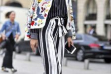 With striped shirt, printed jacket and white heels