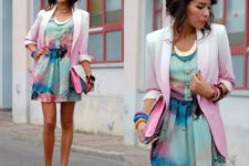With watercolored dress, high heels and clutch