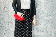 With white blouse, black leather jacket, red bag and black boots