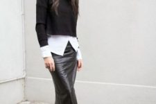 With white shirt, black crop sweater and cutout boots
