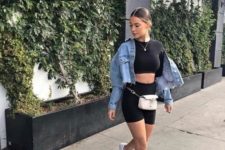 06 a black crop top, black cycling shorts, white sneakers, a white waist bag and a blue cropped denim jacket