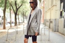 08 a black tee, black cycling shorts, black booties and a light grey oversized blazer by Victoria Beckham