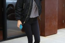 16 a striped top, black skinnies, white sneakers and a black bomber jacket by Gigi Hadid
