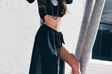 With black maxi skirt, lace up shoes and necklace