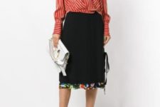 With black midi skirt, white clutch and black flat shoes