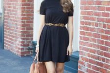 With black mini dress, beige leather bag and ankle strap flats