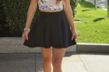 With black skater skirt and golden and black shoes