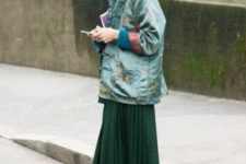 With emerald pleated midi skirt and unique shoes
