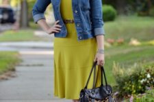 With green dress, denim jacket, printed bag and red shoes
