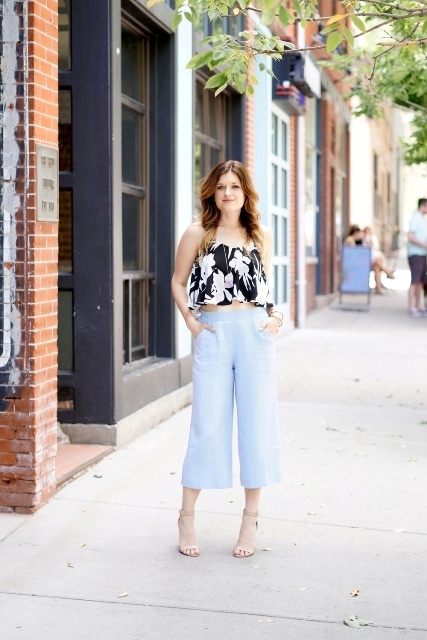 With light blue culottes and beige shoes