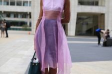 With lilac pumps and leather bag