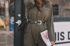 With olive green jumpsuit and bag