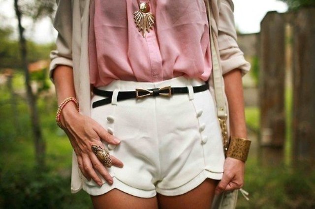 With pink blouse, white shorts, bag and beige shirt