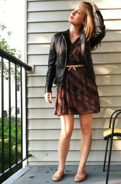 With printed dress, black leather jacket and beige flats