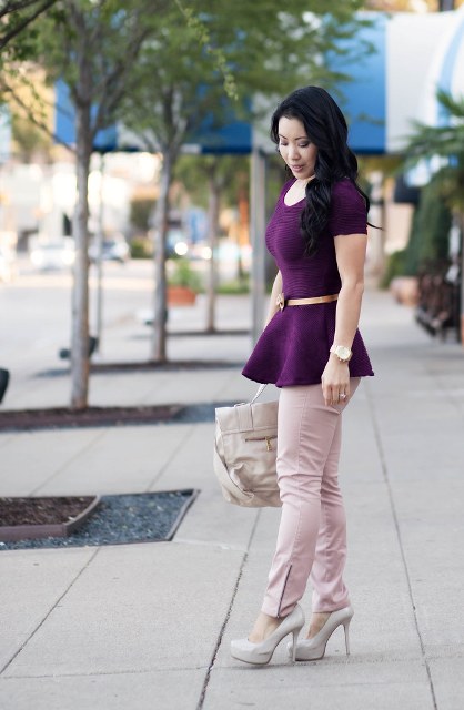 With purple blouse, pale pink pants, high heels and bag
