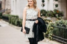 With sleeveless dress, black clutch, black jacket, tights and pumps