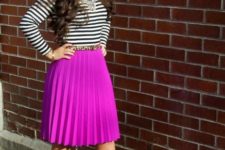 With striped shirt, pink pleated skirt and beige shoes