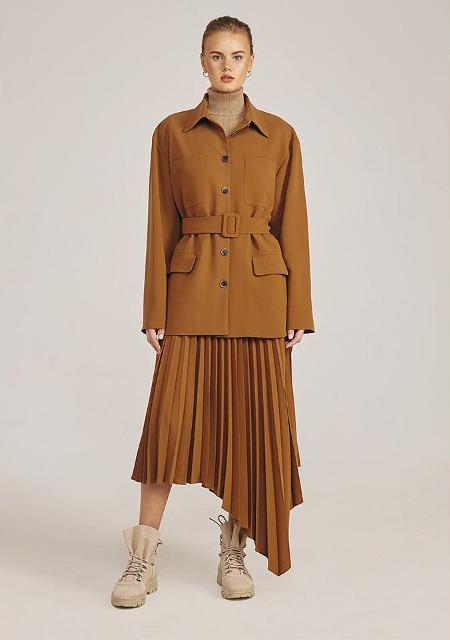 With turtleneck, brown jacket and beige flat boots