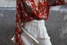 With white high-waisted wide leg pants and white leather clutch