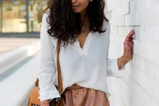 With white loose shirt and yellow tassel bag
