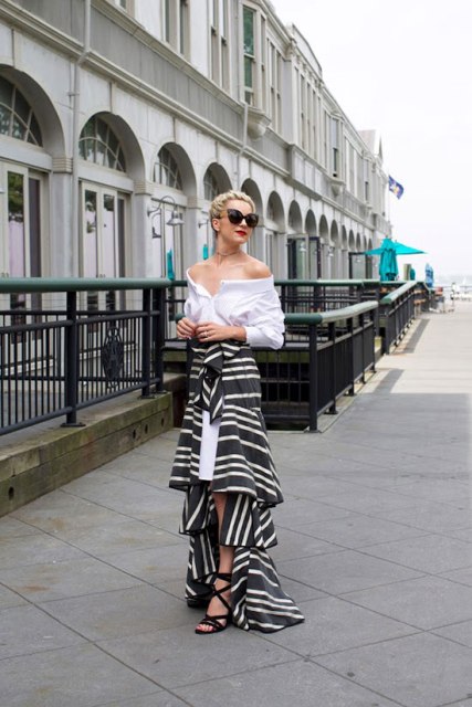 With white off the shoulder blouse, sunglasses and lace up sandals
