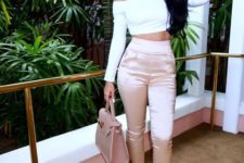 With white off the shoulder top, beige bag and beige pumps