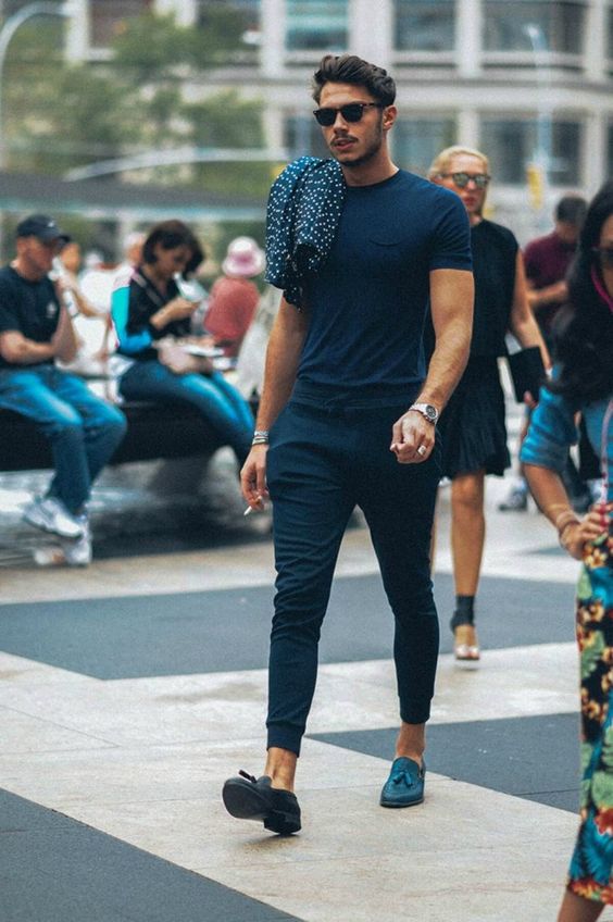 a black tee, black sporty pants, teal loafers and a polka dot button down will make you feel relaxed