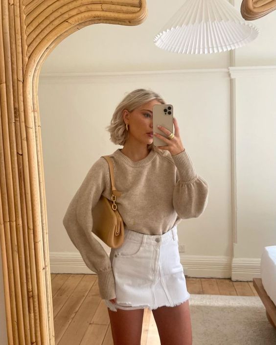 a spring look with a tan jumper, a white denim mini, a beige bag is a sexy and chic outfit to rock