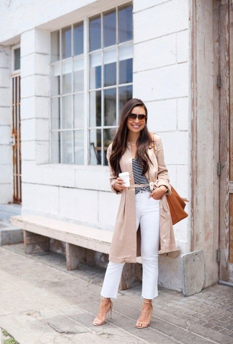 a striped tee, white straight leg jeans, nude heeled sandals, a neutral trench, a camel bag