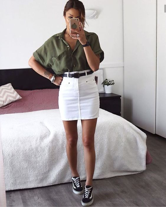 a summer outfit with a khaki linen button down, a white denim mini, a black belt and sneakers is gorgeous