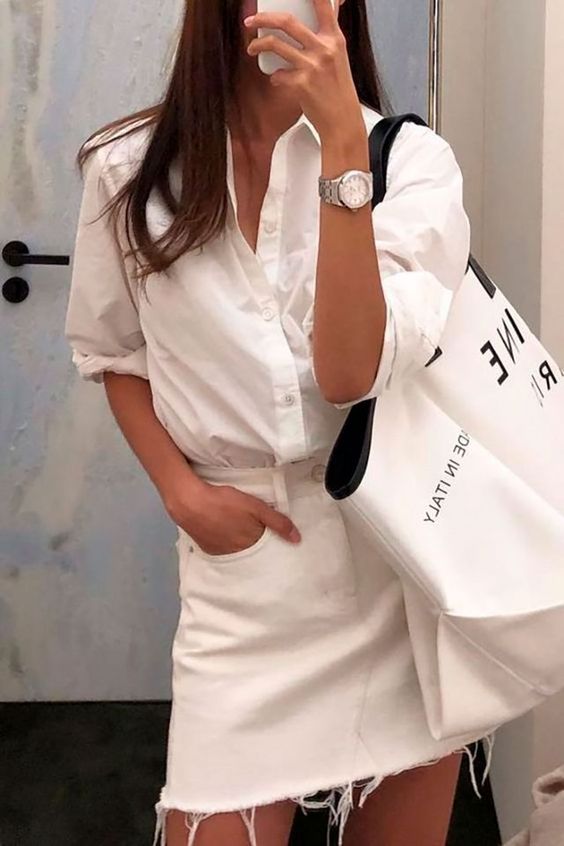 a white summer look with a button down, a denim mini, an oversized tote and a watch