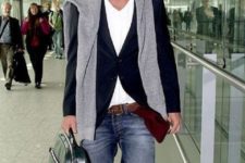a white tee, a black blazer, blue jeans and a grey sweater in case of cold for a casual airport look