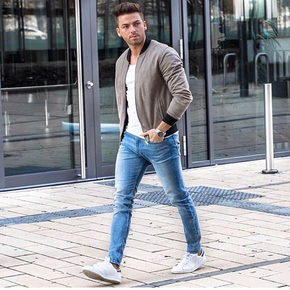 a white tee and sneakers, a grey bomber jacket and blue skinnies for a modern transitional look