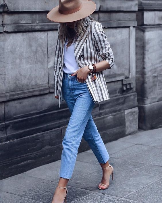 a white tee, blue cropped straight leg jeans, nude heeled sandals, a striped blazer and a camel hat