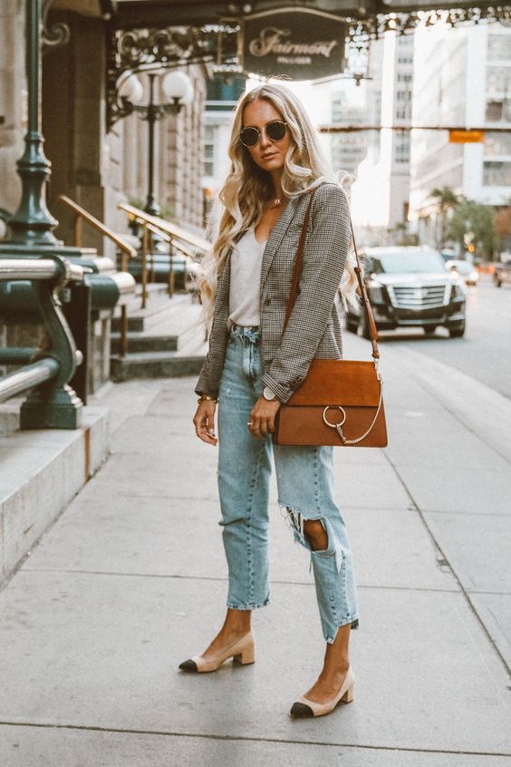 a white top, blue distressed straight leg jeans, a checked blazer, nude and black slingbacks and a camel bag