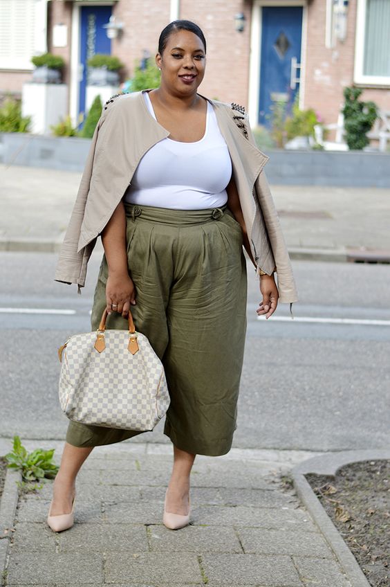 a white top, olvie green culottes, nude shoes, a neutral jacket and a printed bag