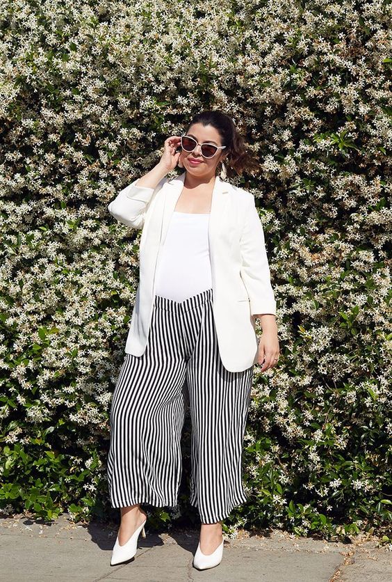 a white top, striped black and white culottes, white mules and a white blazer for work