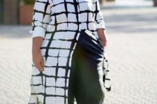 black culottes, a long black and white button down and black strappy shoes