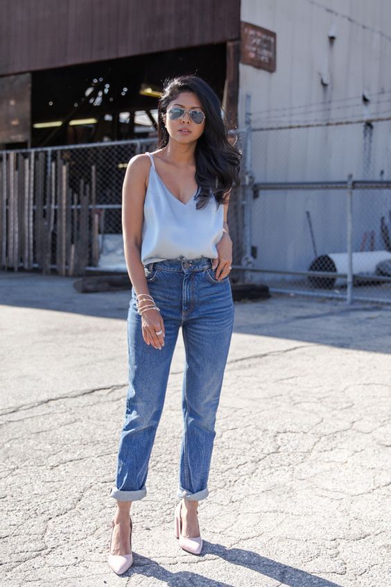 creamy heels, blue high waisted jeans and a grey silk spaghetti strap top