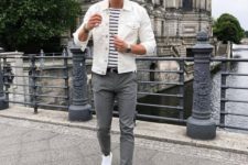 grey skinnies, a striped tee, a white denim jacket, white sneakers for a relaxed look