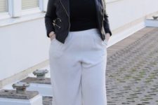 white culottes, a black tee, a black denim jacket, black shoes for a chic look