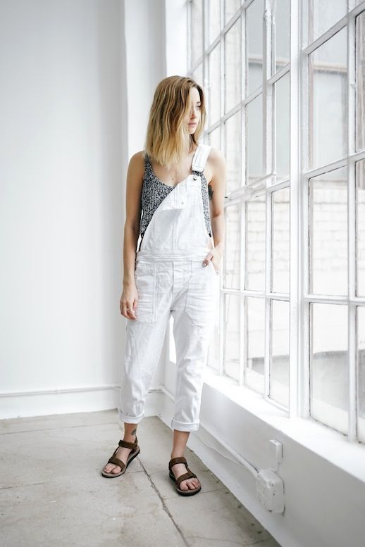 a grey printed top, a white denim overall, brown dad sandals for maximal comfort