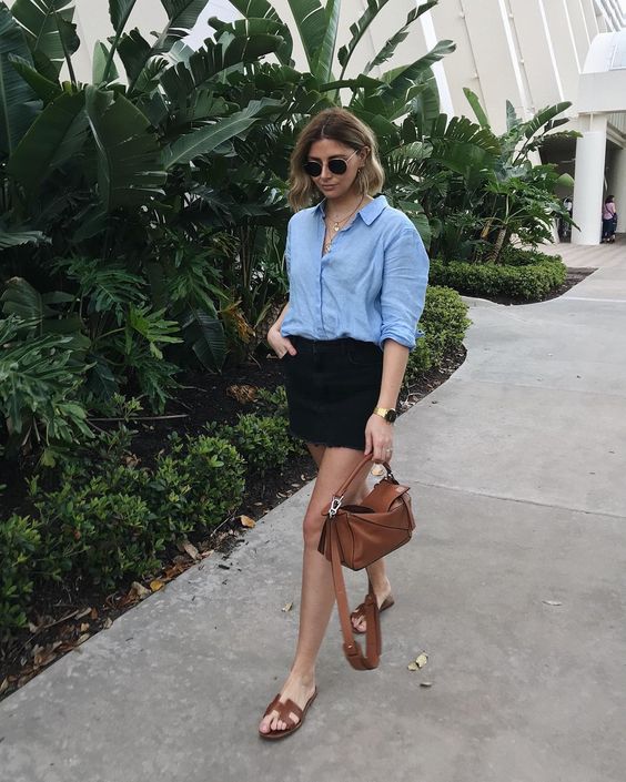 a blue shirt, a black mini, brown square toe sandals and a brown leather bag for a casual feel