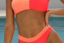 07 a bright bikini with a color block hot pink and orange bandeau top and a matching bottom